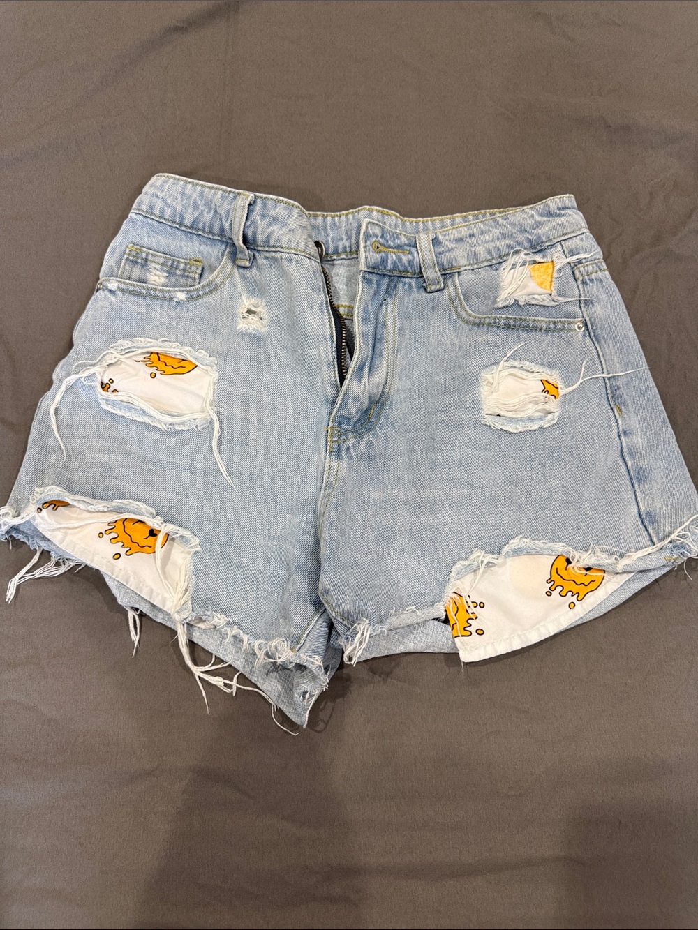 SHEIN Light Blue Distressed High-Rise Denim Shorts with Yellow Sun Patches